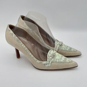 Stuart Weitzman Animal Print Leather and Canvas Pointed Toe Heels.